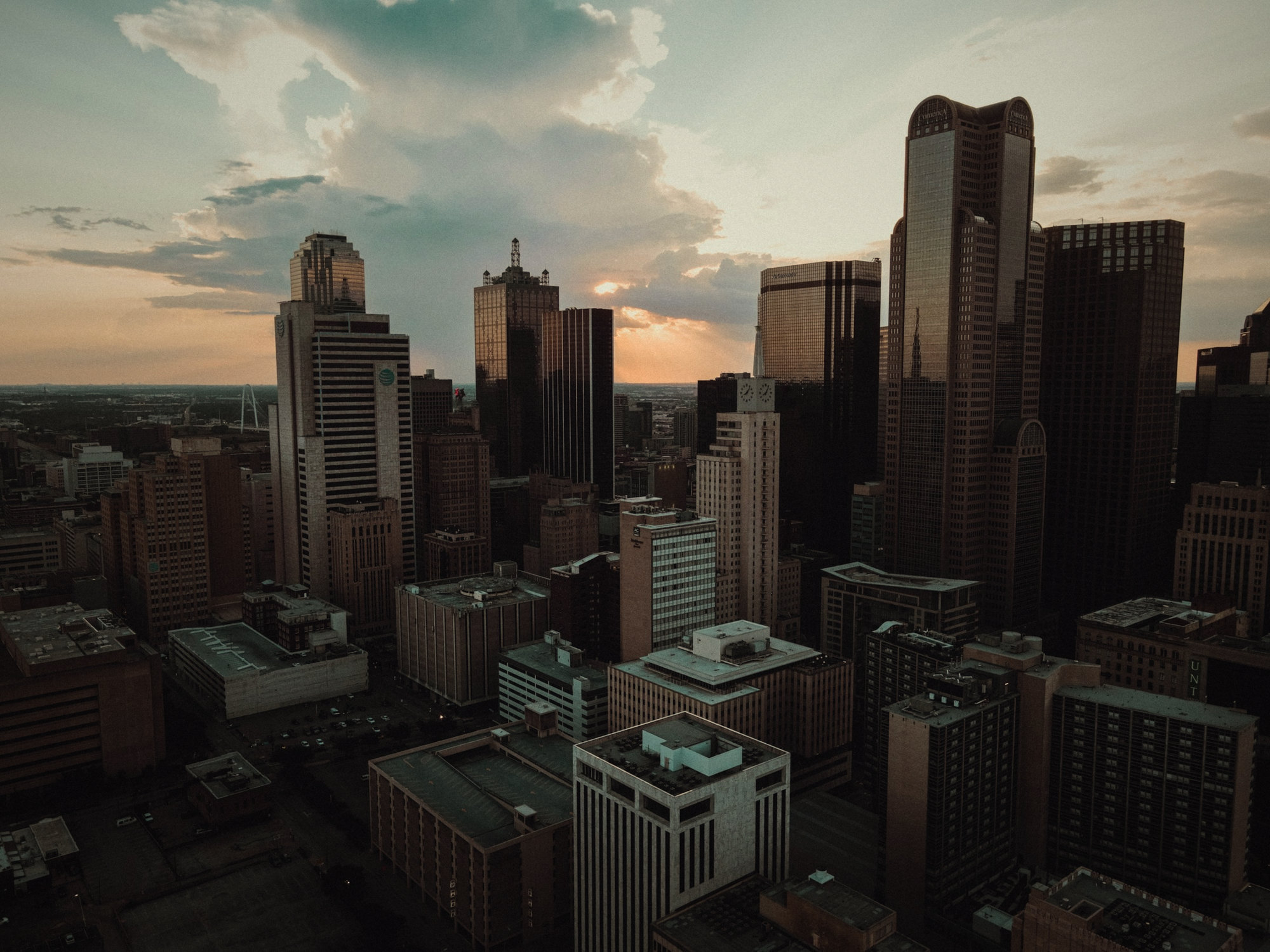 An aerial view of a city at sunset